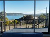 Lounge room with views over the bay and beach